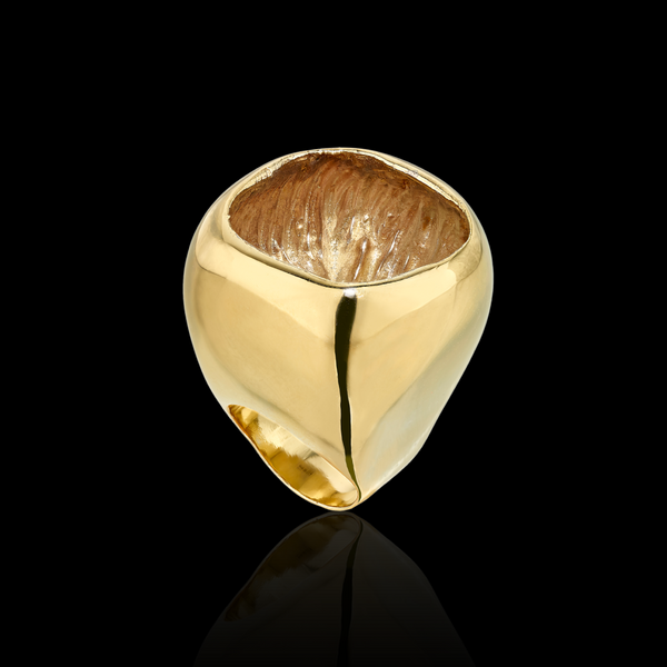 Emefa Cole old ring with a central brown stone on a black background