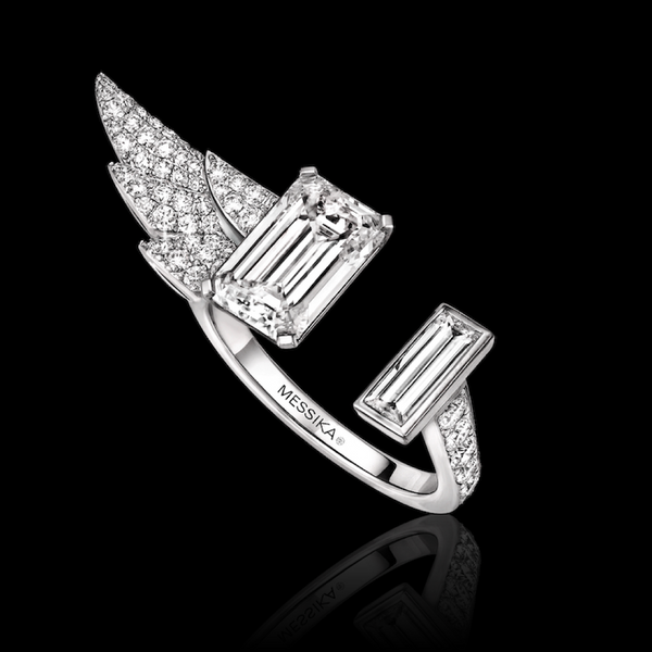 Messika silver ring with diamond accents on a black background